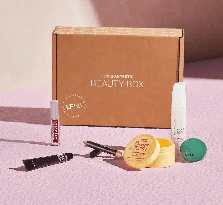 A LookFantastic Beauty Box with assorted makeup and skincare products displayed in front.
