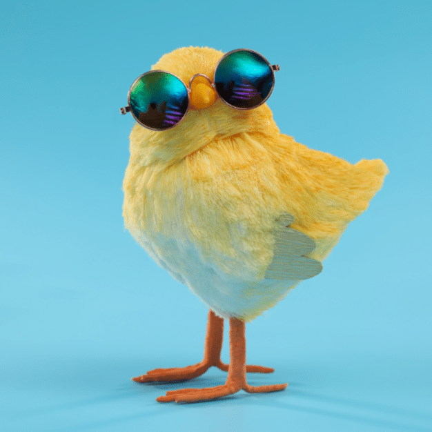 PlayfullyPragmatic A cute yellow chick wearing round sunglasses stands on a blue background.