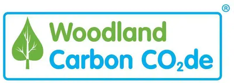 Green leaf icon next to the words "Woodland Carbon CO2de" in green and blue text.